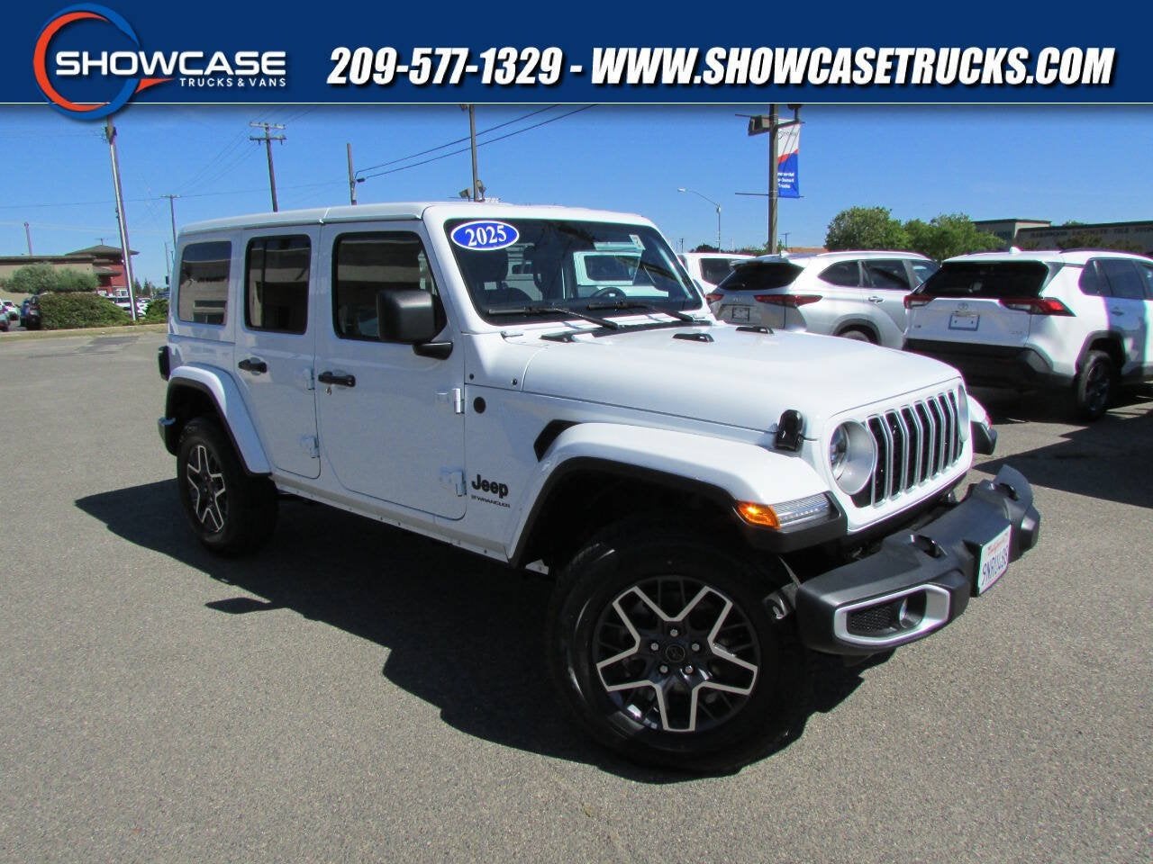 2025 Jeep Wrangler Sahara in Bright White Clearcoat — front three-quarter view