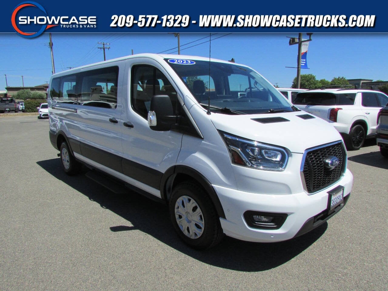 2023 Ford Transit Passenger Wagon 350 XLT 3dr LWB Low Roof Passenger Van in Oxford White — front three-quarter view