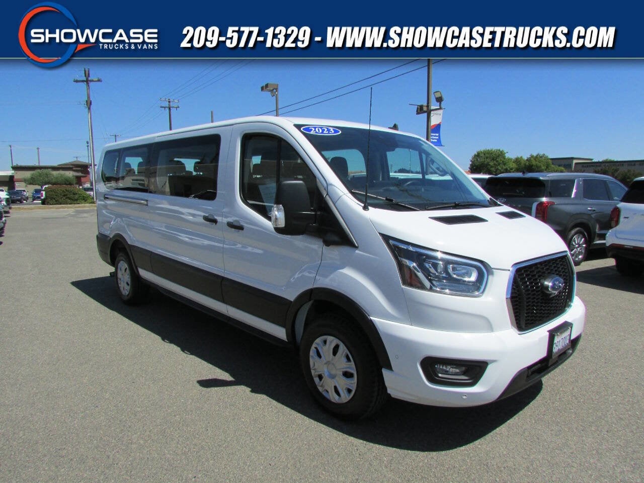 2023 Ford Transit Passenger Wagon 350 XLT 3dr LWB Low Roof Passenger Van in Oxford White — front three-quarter view