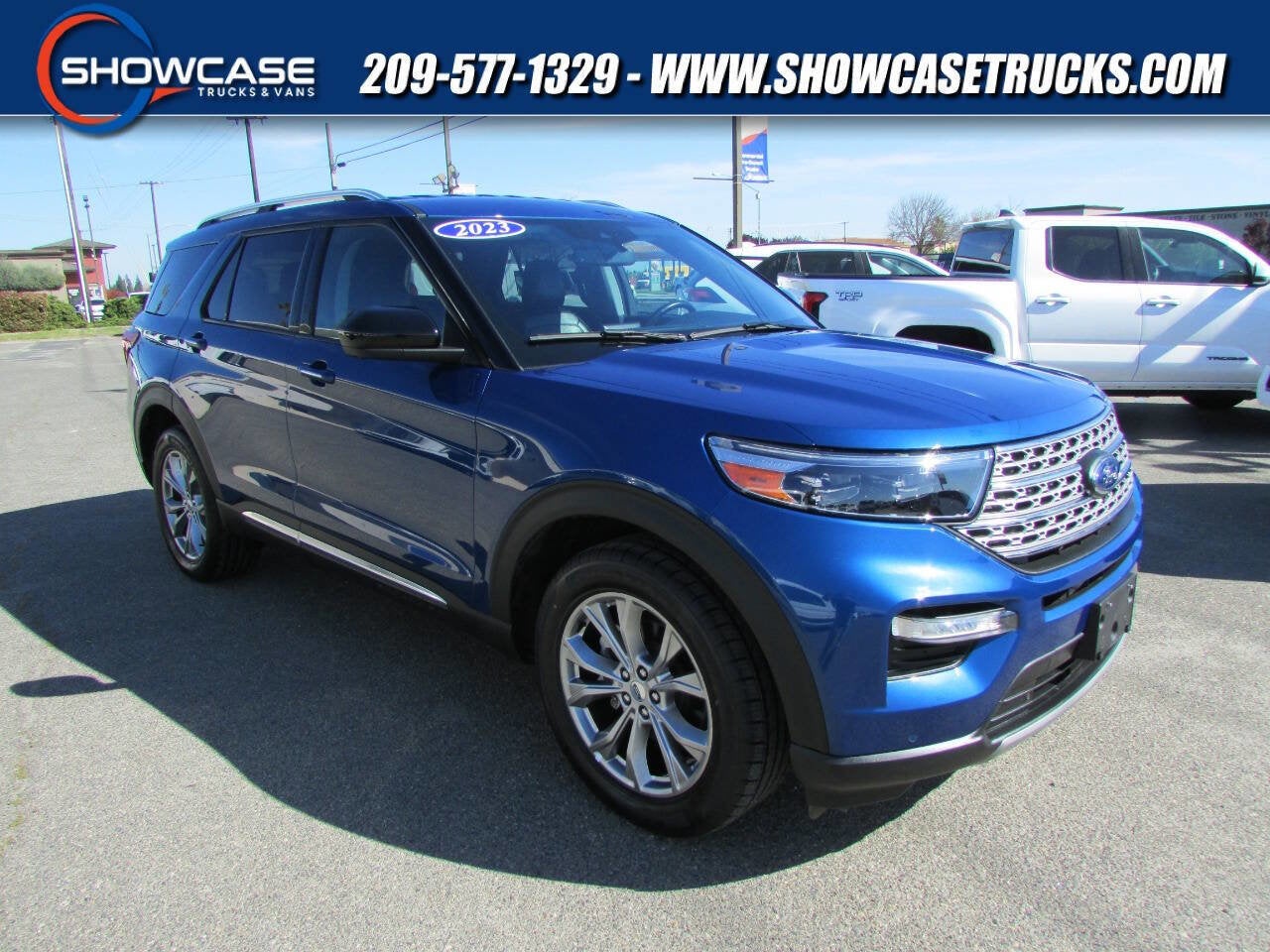 2023 Ford Explorer Limited in Atlas Blue Metallic — front three-quarter view