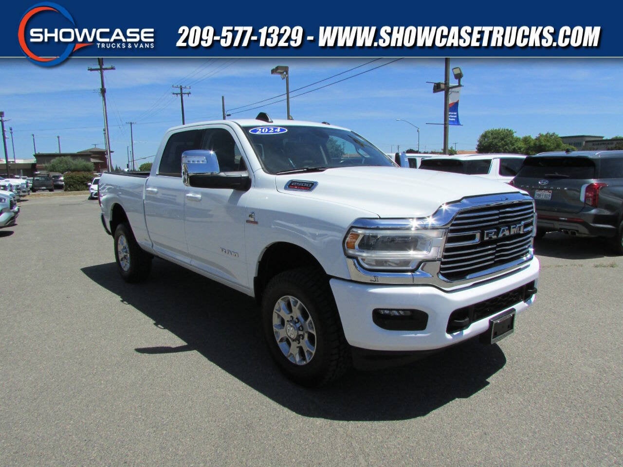 2024 RAM 2500 Laramie in Bright White Clearcoat — front three-quarter view