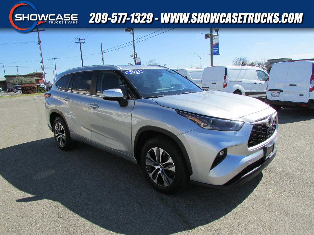 2023 Toyota Highlander XLE 4dr SUV in Silver Metallic — front three-quarter view